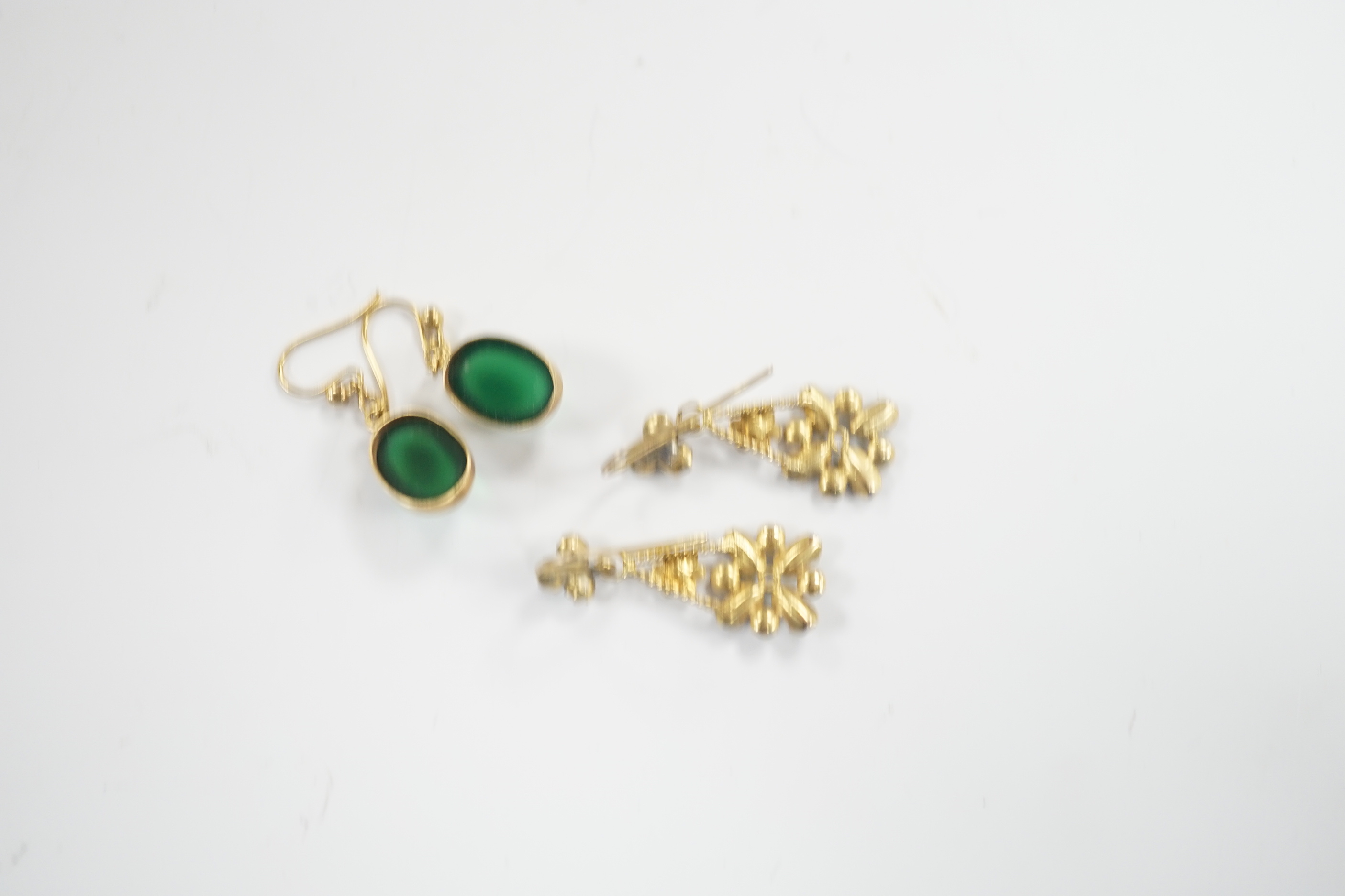 A pair of yellow metal and cabochon chrysoprase set drop earrings and a pair of yellow metal, aquamarine coloured stone and split pearl cluster set drop earrings, gross weight 5.6 grams.